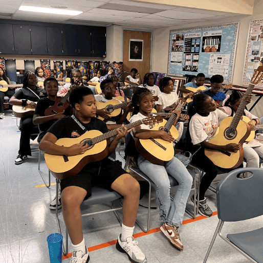 music class students playing guitar